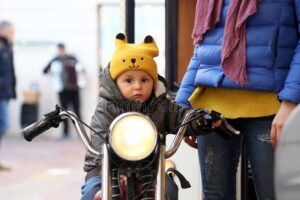cute baby boy sitting motorcycle cute baby boy sitting vintage motorcycle little boy carousel close up 137837114